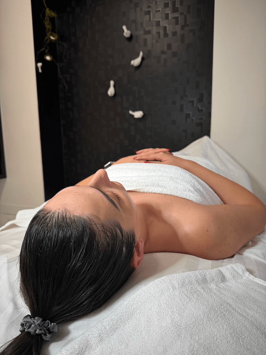 Relaxed client on a treatment bed at Zohreh Spa in Port Moody